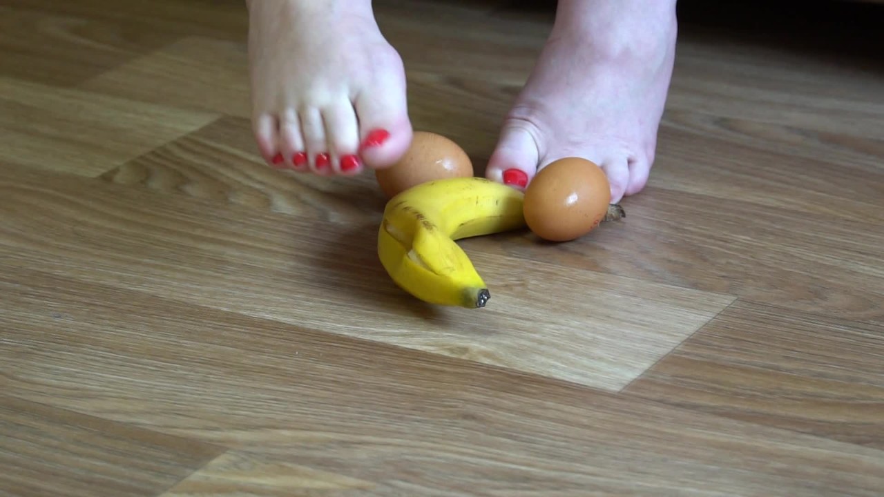 Fat legs bare feet mercilessly trampled banana and raw eggs. Crush fetish.