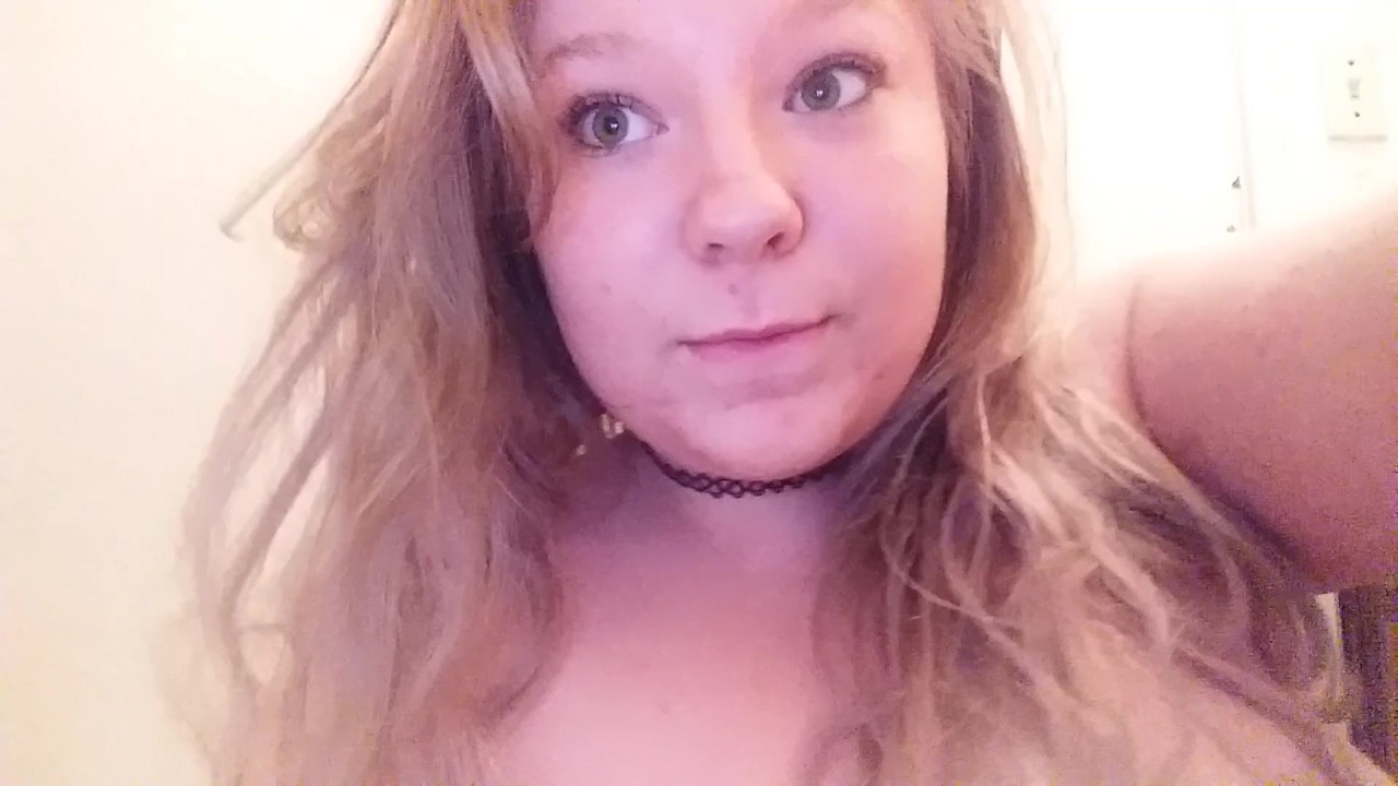 Horny teen girl strips and sucks on fingers